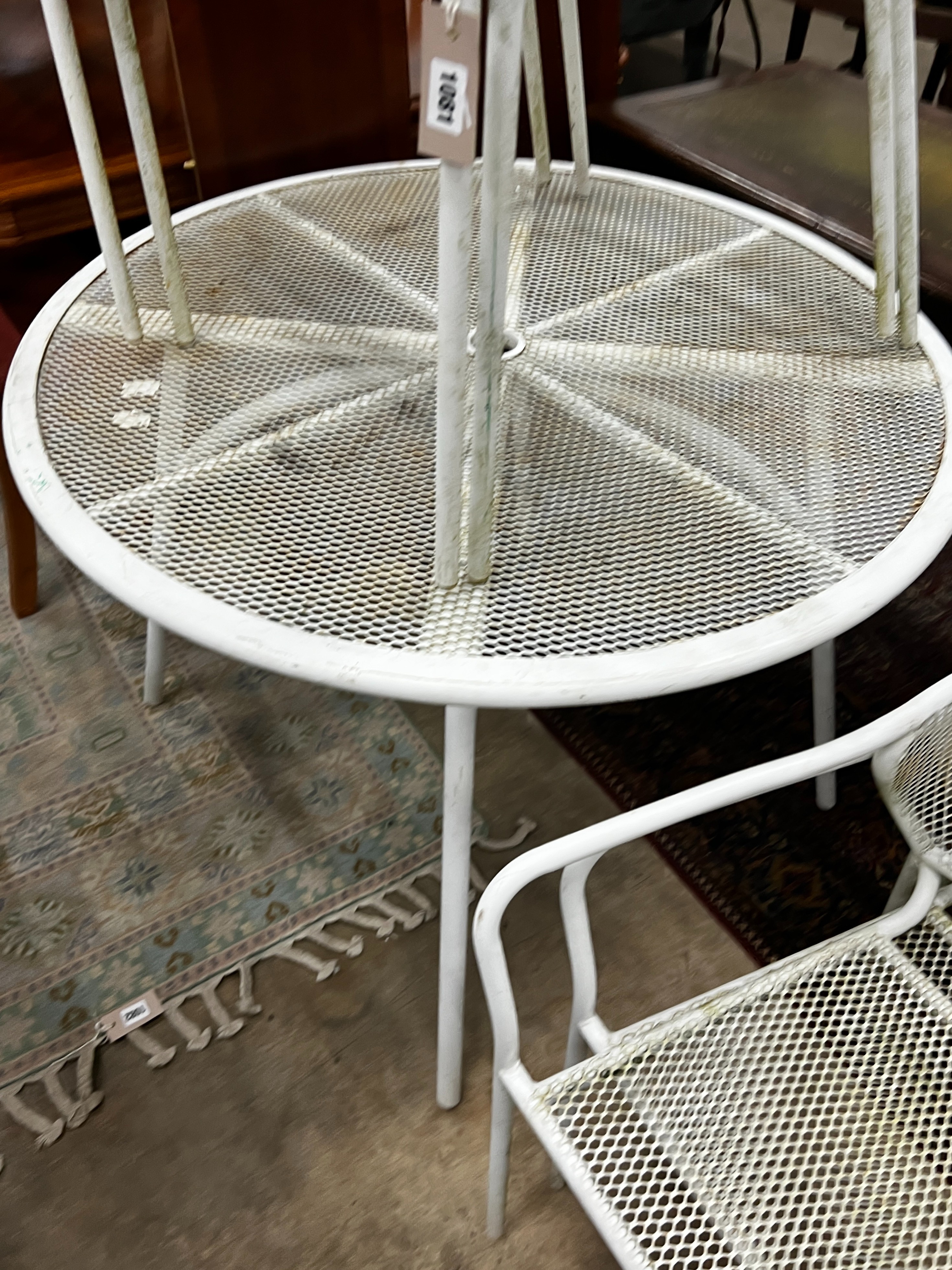 A circular painted aluminium garden table, diameter 100cm, height 72cm together with four matching stacking chairs